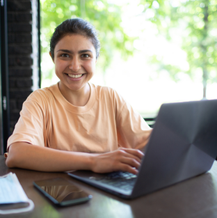 Smiling person with laptop